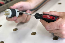 144 Piece Household Tool Kit with 4.8V Cordless Screwdriver - DT8422 screwdriver shown in use on electric plug