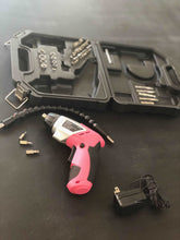 3.6 Volt Lithium-Ion Rechargeable Screwdriver with 45 Piece Accessory Set - Pink DT4944P shown on black table, cordless outside the case