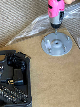 3.6 Volt Lithium-Ion Rechargeable Screwdriver with 45 Piece Accessory Set - Pink DT4944P shown in use to tighten screws while assembling furniture