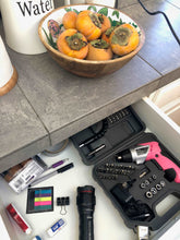 3.6 Volt Lithium-Ion Rechargeable Screwdriver with 45 Piece Accessory Set - Pink DT4944P shown open inside kitchen drawer