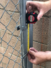 Apollo Tools 144 Piece Household Tool Kit with 4.8V Cordless Screwdriver - DT8422 tape measure shown in use on metal gate