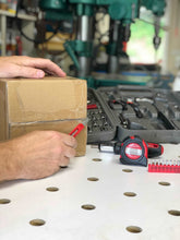 Apollo Tools 79 Piece Multi-Purpose Tool Kit - DT9411 shows open case with tools and man's hand using utility knife