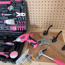 New and Improved 135 Piece Pink Household Tool Set with Pivoting Dual-Angle 3.6 Volt Lithium-Ion Cordless Screwdriver in Hard Case - DT0774P shows open set and a few tools out in DIY setting