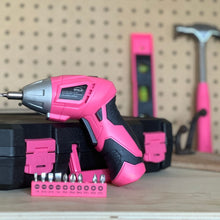 New and Improved 135 Piece Pink Household Tool Set with Pivoting Dual-Angle 3.6 Volt Lithium-Ion Cordless Screwdriver in Hard Case - DT0774P shows cordless screwdriver and bit on foreground and blurred tool case and tools in the background