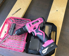 pink cordless drill with drill bits and screwdriver bits