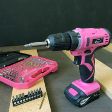 Apollo Tools 10.8 Volt Lithium-Ion Cordless Drill with 30 Piece Accessory Set PINK - DT4937P shows product with bit inserted, bits bar and accessory case open against black and wood background