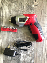 Apollo Tools 161 Piece Household Tool Kit with Convenient 3.6 Volt Lithium Ion Cordless Screwdriver - DT0739 shows cordless screwdriver, charger and a bit bar on wood background