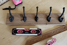 pink 9-inch torpedo-shaped spirit level with donation to breast cancer