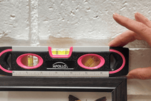 pink 9-inch torpedo-shaped spirit level with donation to breast cancer