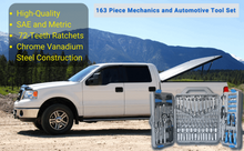 Apollo Tools 163 Piece Mechanics and
 Automotive Tool Set lifestyle image.  Tool set shown open next to white pick up truck with mountainous background