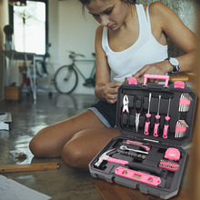 Apollo Tools 65 Piece Household and Mechanical Tool Set lifestyle image young woman in garage using tool set