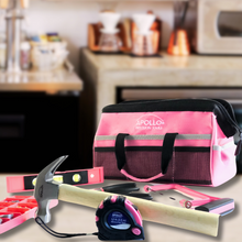 APOLLO TOOLS 201 Piece Household Tool Kit in a Soft-Sided Tool Bag Pink lifestyle image shows product against kitchen blurred background