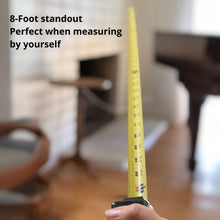 APOLLO TOOLS 25ft. Tape Measure - Black - DT5002 show stand out of the product and the words: 8-foot standout perfect when measuring by yourself