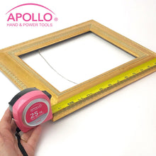 Apollo Tools 25ft. Tape Measure - Pink - DT5002P shows product in use measuring a frame