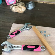 APOLLO TOOLS 2 Adjustable Wrenches - Pink - DT5007P lifestyle image  shows two wrenches on wood background