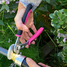 APOLLO TOOLS 3 Pliers set - Pink - DT5008P showing large wrench in use on a garden hose