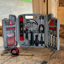 Apollo Tools 53 Piece Household Tool Kit - DT9408 lifestyle image shows an open tool set with a tape measure in the foreground and construction site in background