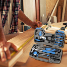 Apollo Tools 39 piece tool set model DT9706BL (blue)  shows open tool set in foreground and man measuring wood in background