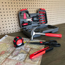 Apollo Tools 39 piece tool set model DT9706 red shows open tool set against peg board and wood background, utility knife, scissors, tape measure and hammer in foreground