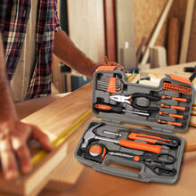 Apollo Tools 39 piece tool set DT9706OR (orange) shows tool set in foreground and man measuring wood on background