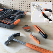 Apollo Tools 39 piece tool set DT9706OR (orange) shows close up of pliers in use and other tools on wood background