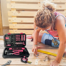 APOLLO TOOLS 39 Piece General Pink Tool Set in Storage Case with upgraded Tool Selection DT9711P shows lifestyle image of woman and wood background and open tool set in foreground