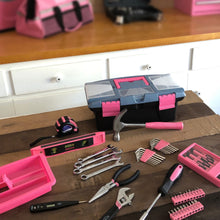 Apollo Tools 53 Piece Household Tool Kit with Tool Box Pink- DT9773P  shows closed box and all tool sets on wood tabletop